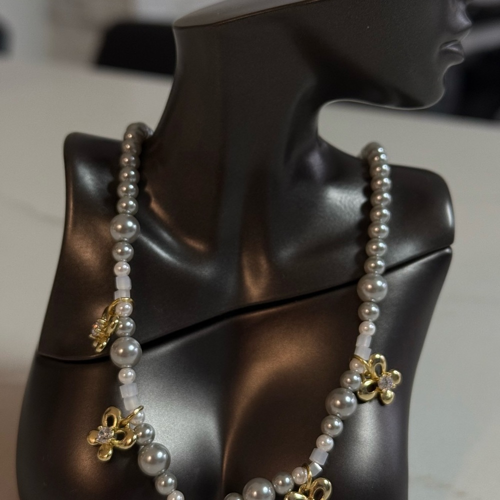 Gold and White Beaded Necklace with Intricate Pendants